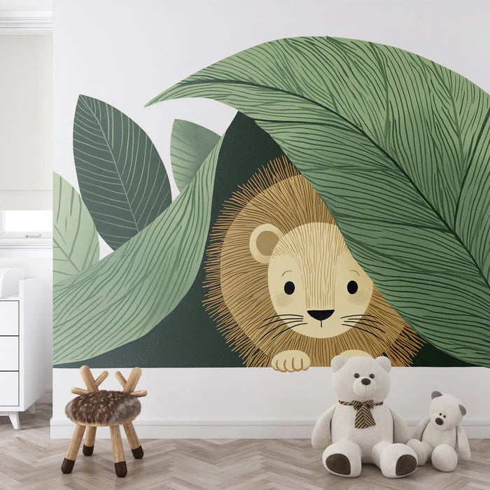 Hidden lion mural wallpaper | A cute lion cub behind lush leaves
