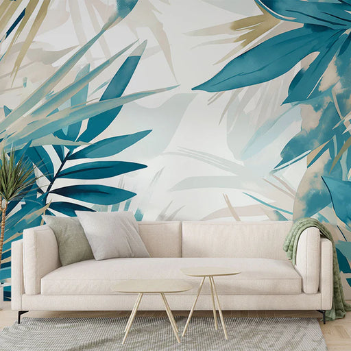 Pastel foliage mural wallpaper in tundra blue featuring tropical leaves in turquoise and cream tones for bedroom decoration
