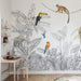 Tropical jungle mural wallpaper in grayscale featuring palm leaves, banana foliage and exotic birds with color accents
